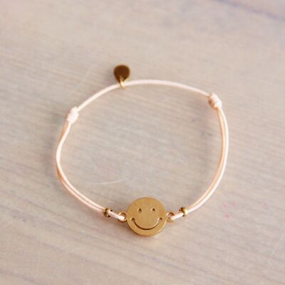 Elastic bracelet with smiley – peach/gold
