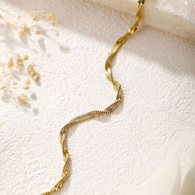 Golden snake chain bracelet turned