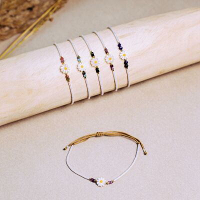 Mother-of-pearl bracelets, flower stones and luminous white pearls