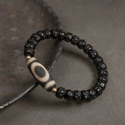 Schwarzes Perlenarmband aus Kokosnussschale mit tibetischer Dzi-Perle