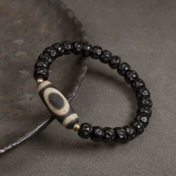 Bracelet de perles de coquille de noix de coco noire avec perle tibétaine Dzi 1