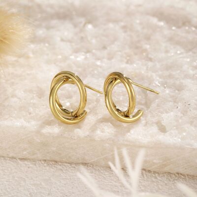 Golden chip earrings with crossed out circle