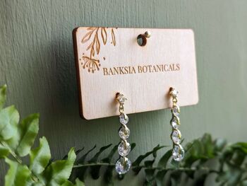 Boucles d'oreilles pendantes en or avec zircons cubiques