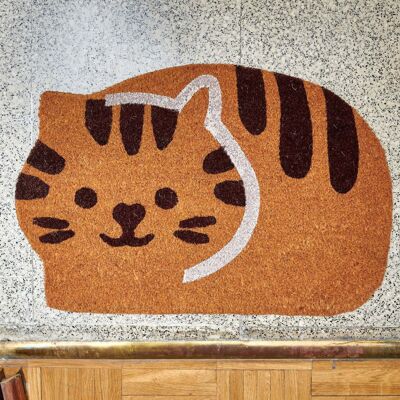 Doormat in the shape of a curled up cat