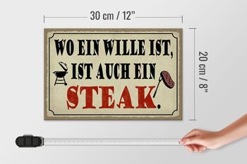Panneau en bois indiquant 30x20cm où se trouve un grill à steak 4
