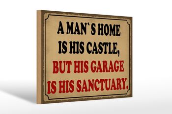 Panneau en bois disant 30x20cm à un homme est son château mais son garage 1