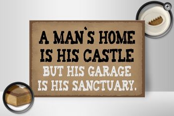 Panneau en bois indiquant 30x20cm La maison de l'homme est le garage de son château 2