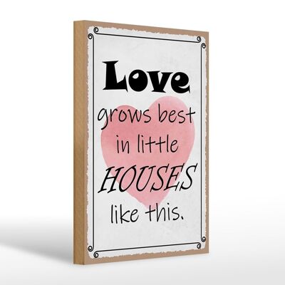 Cartel de madera que dice 20x30cm el amor crece mejor en las casitas