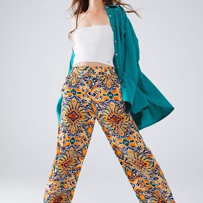 Pantalon multicolore à imprimé fleuri en orange et bleu