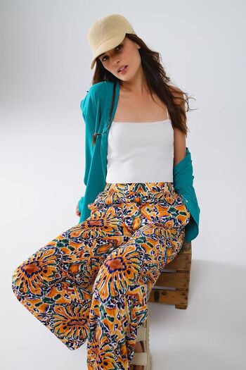 Pantalon multicolore à imprimé fleuri en orange et bleu 4