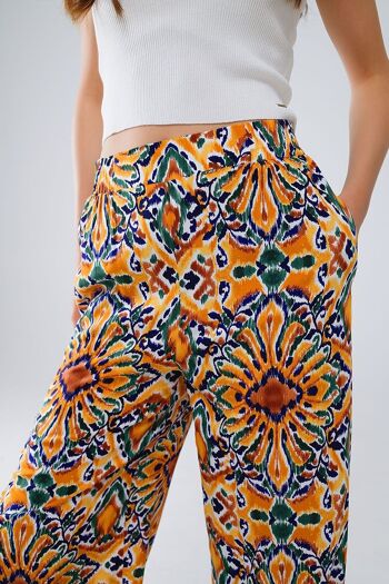 Pantalon multicolore à imprimé fleuri en orange et bleu 5