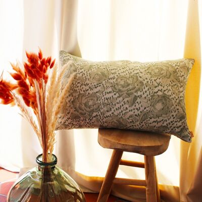 Green decorative cushion in cotton gauze