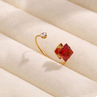 Thin gold ring opening with red rhinestones