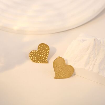 Gold asymmetrical hammered heart earrings