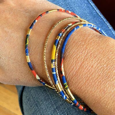 Fine bracelets in navy blue, red, yellow and gold wax