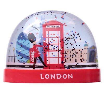 Cabina telefonica rossa souvenir di Londra e tempesta di neve glitterata grande guardia