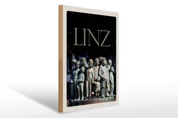 Panneau en bois voyage 30x40cm Linz Autriche sculpture personnes 1