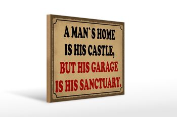 Panneau en bois disant 40x30cm à un homme est son château mais son garage 1