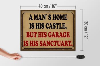 Panneau en bois disant 40x30cm à un homme est son château mais son garage 4