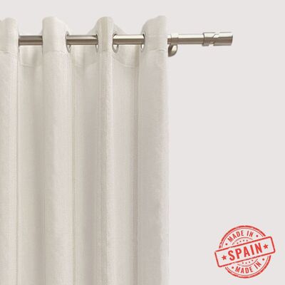 Beige translucent curtain made in eyelets. Jacquard curtain with vertical stripes made with recycled and quality materials. Natural and warm colors. Curtains for living room, bedroom and kitchen.