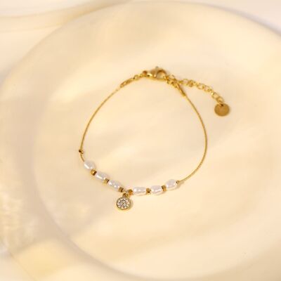 Gold multi pearl bracelet with rhinestone pendant