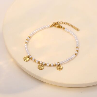 Golden beaded bracelet and golden beads with round hammered pendants