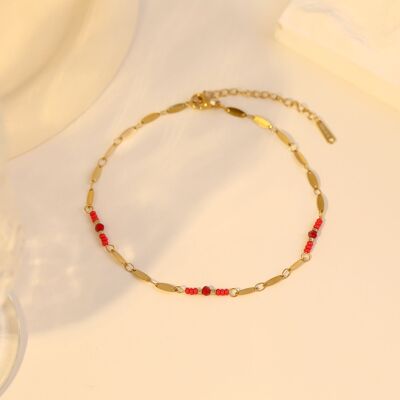 Gold anklet with red beads