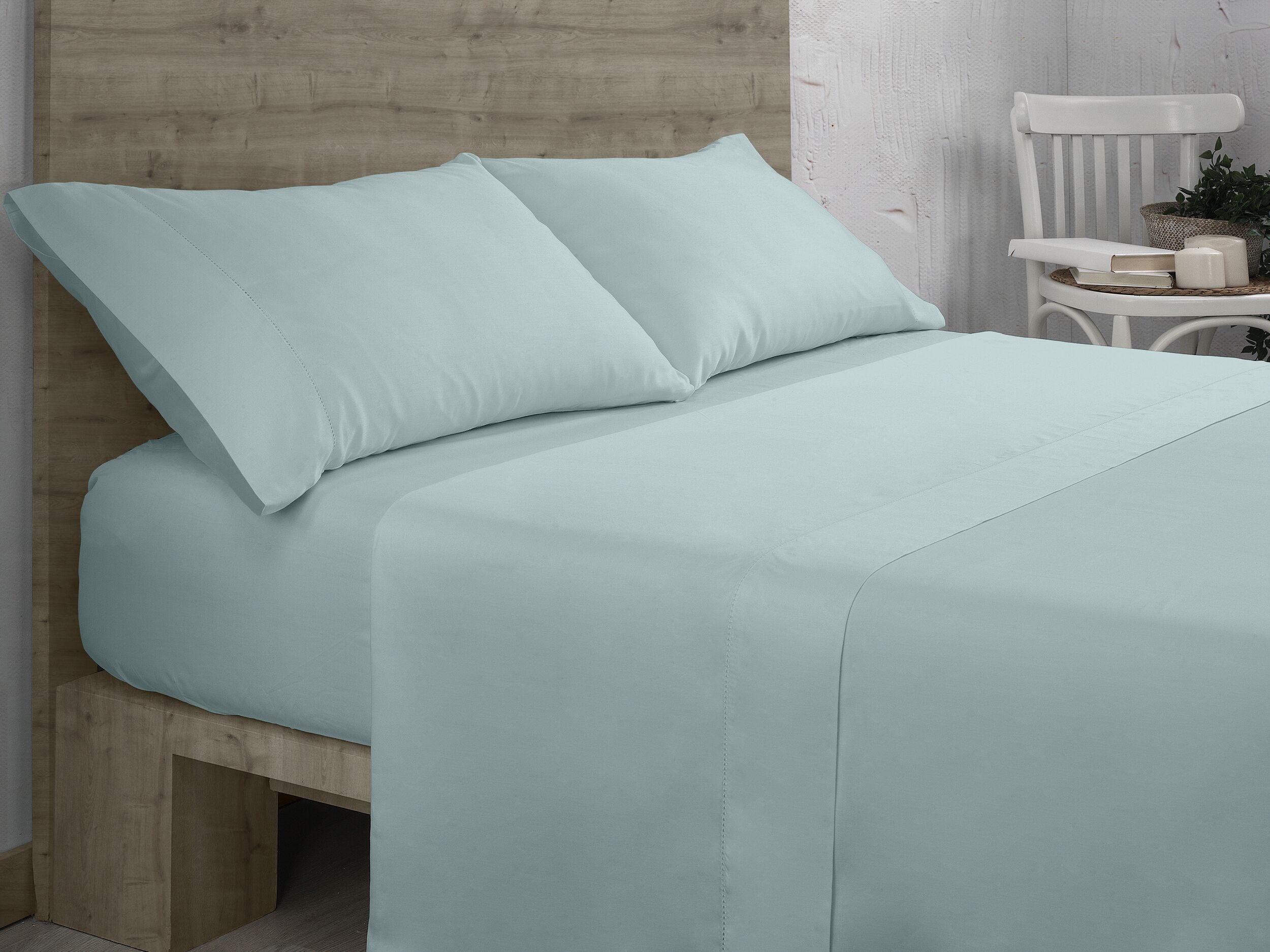 Completo lenzuola in cotone organico color ghiaccio. Finitura a orlo a giorno. Letto da 105 centimetri. 3 pezzi