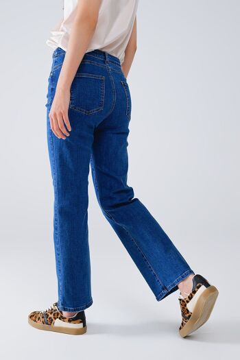 Jean basique en denim bleu foncé avec détail tressé à la taille 4