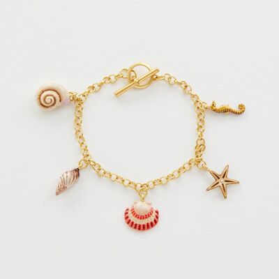 Pulsera de dijes de oro desgastada con concha pintada a mano