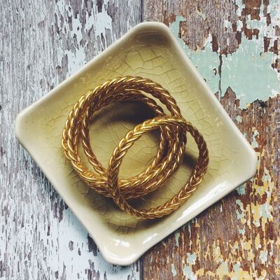 Marca oficial: pulsera budista de trenza fina.