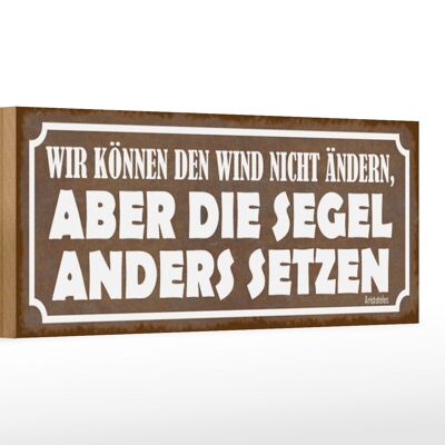 Cartello in legno di 27x10 cm con scritta "Non possiamo cambiare il vento".