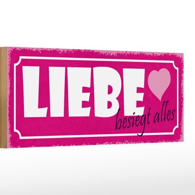 Holzschild Spruch 27x10cm Liebe besiegt alles Herz