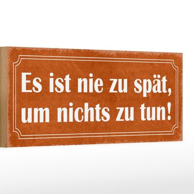 Cartello in legno 27x10 cm con scritta "Non è mai tardi per non fare nulla".