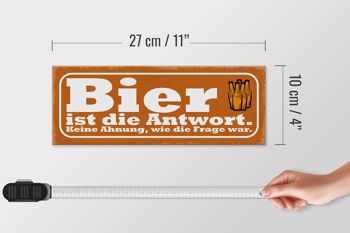 Panneau en bois indiquant 27x10cm La bière est la réponse à la question 4