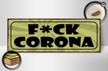 Panneau en bois indiquant 27x10cm F*CK Corona 2