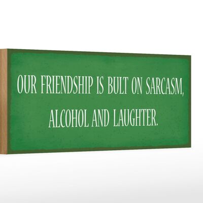 Letrero de madera que dice 27x10cm nuestra amistad es todo sarcasmo