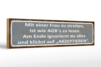 Panneau en bois indiquant 46x10cm avec une femme se disputant comme lisant les termes et conditions, décoration 1