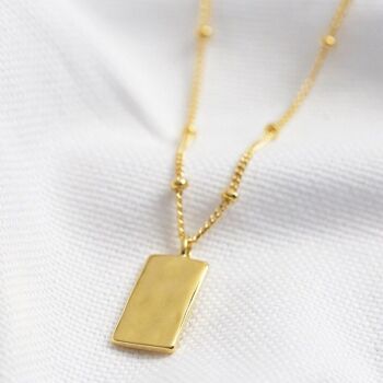 Collier pendentif petite étiquette martelée en or