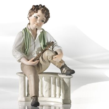 Figurine en porcelaine Philippe, garçon à la flûte 1