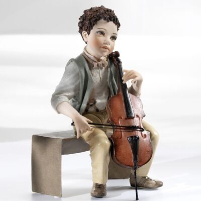 Figura de porcelana Nocturno, niño con violonchelo.