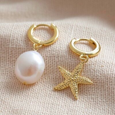 Aretes tipo argolla con perla y estrella de mar en oro