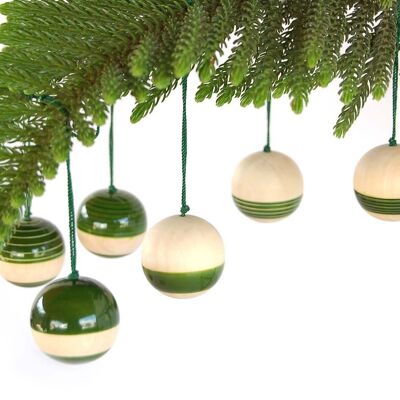 Palline di Natale in legno verde - fondo a strisce luminose