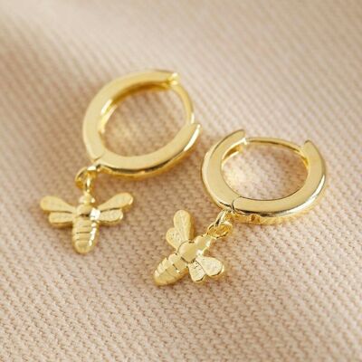 Aretes tipo argolla Tiny Bee Huggie en oro