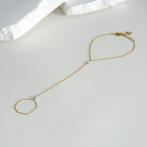 Bracelet bague chaîne dorée avec deux cristaux bleus