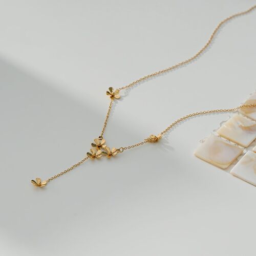 Collier doré en Y avec pendentif fleur