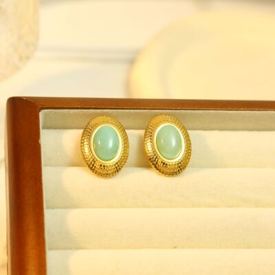 Pendientes clip ovalados dorados con piedra natural azul