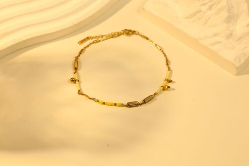 Chaîne de cheville dorée avec perles jaunes
