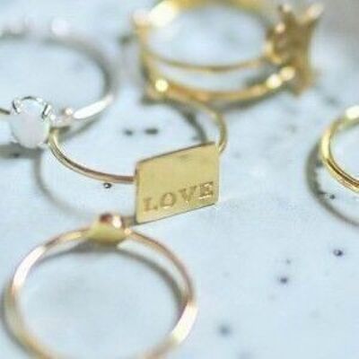 Gold steel ring engraved love