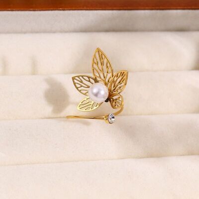 Anillo de apertura frontal con flor y perla